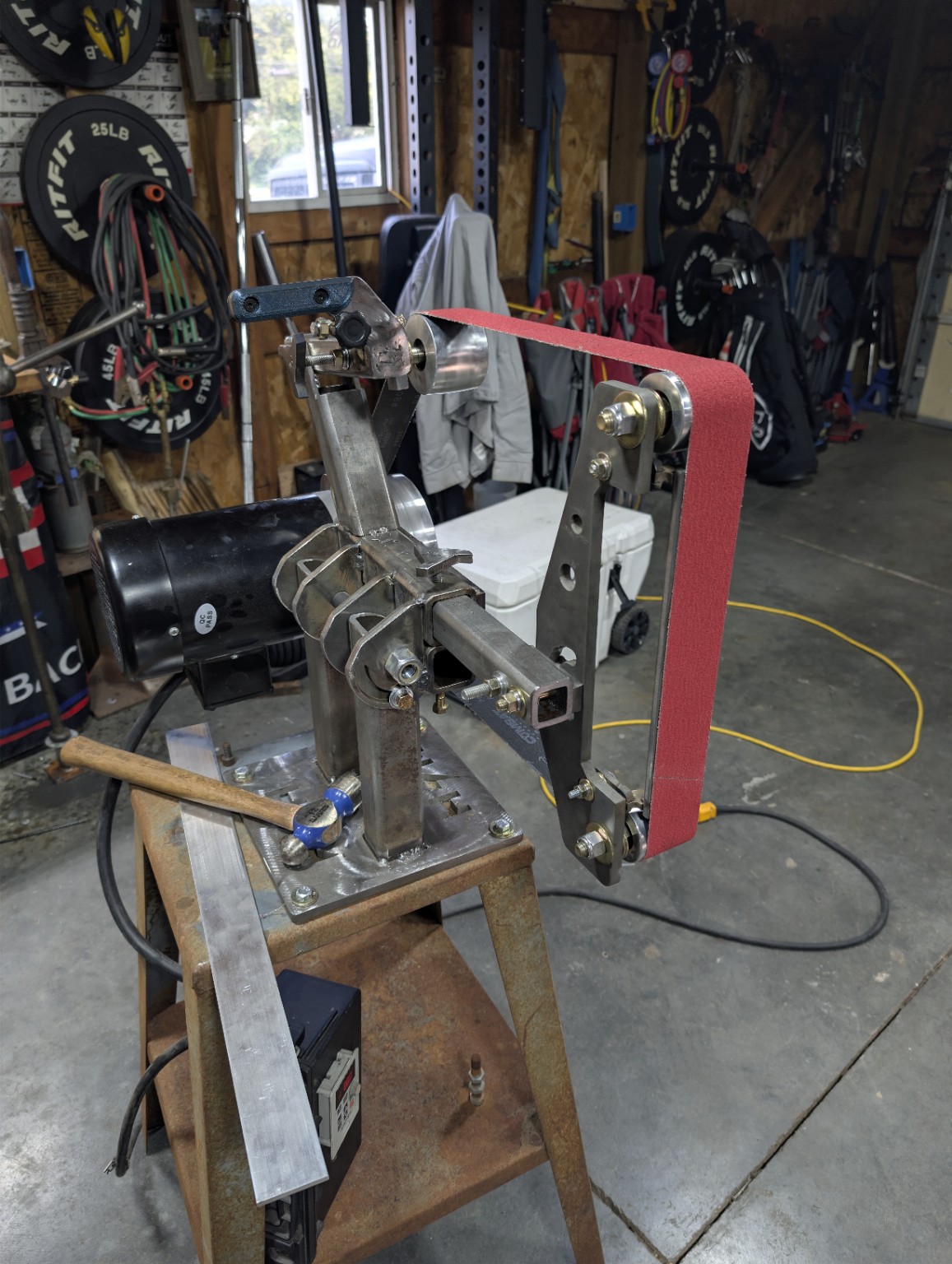 Knife belt grinder in Ghost Antler Forge shop