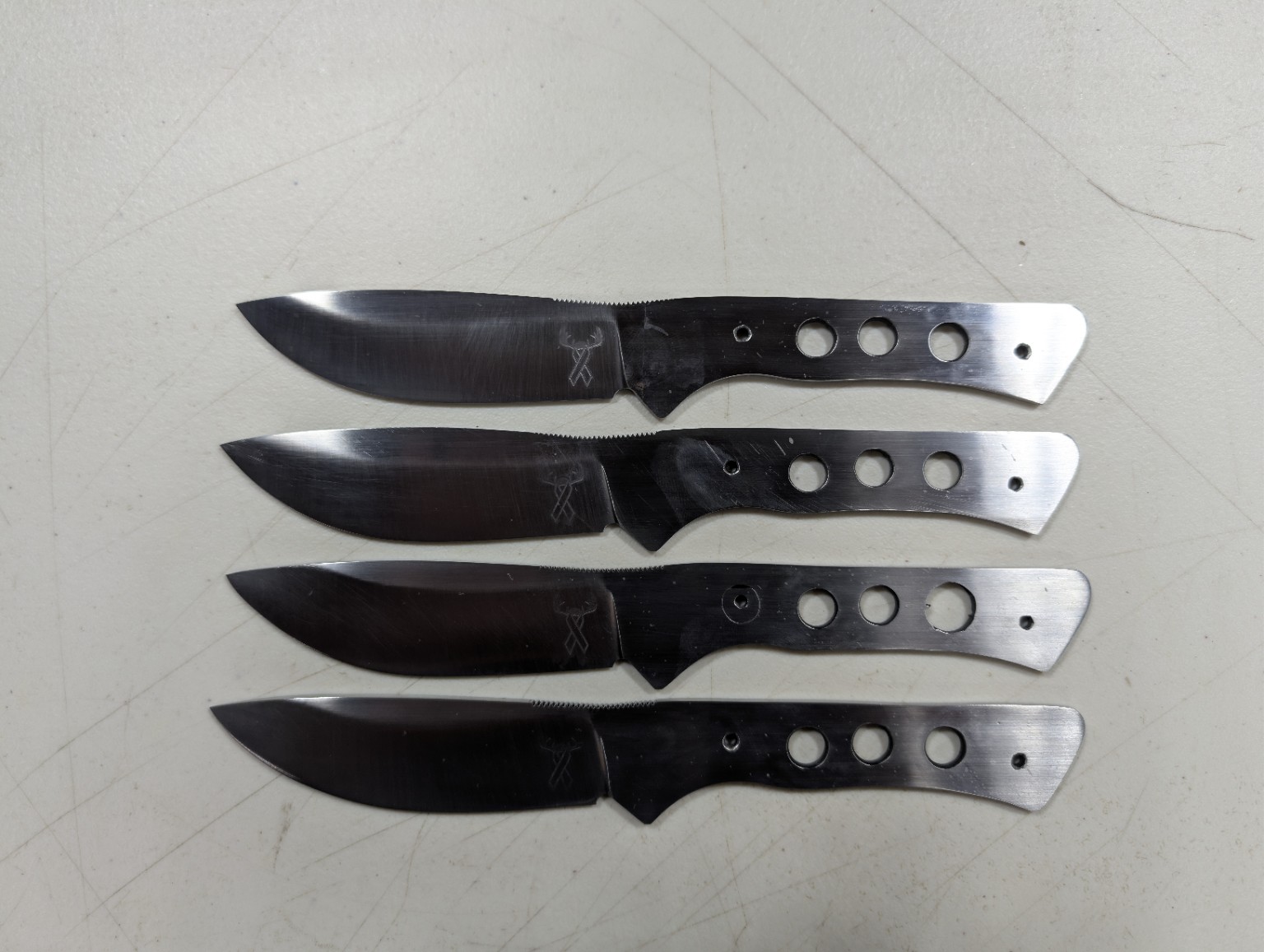 Four knife blanks in progress